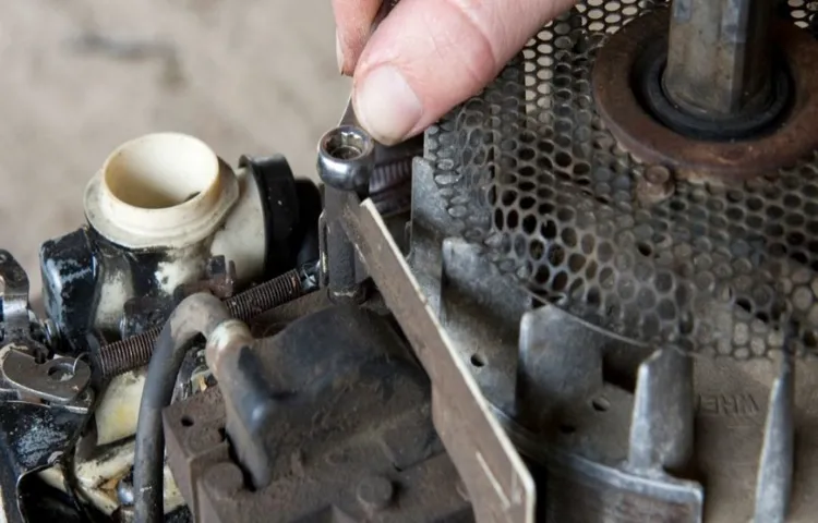 how to get water out of lawn mower carburetor