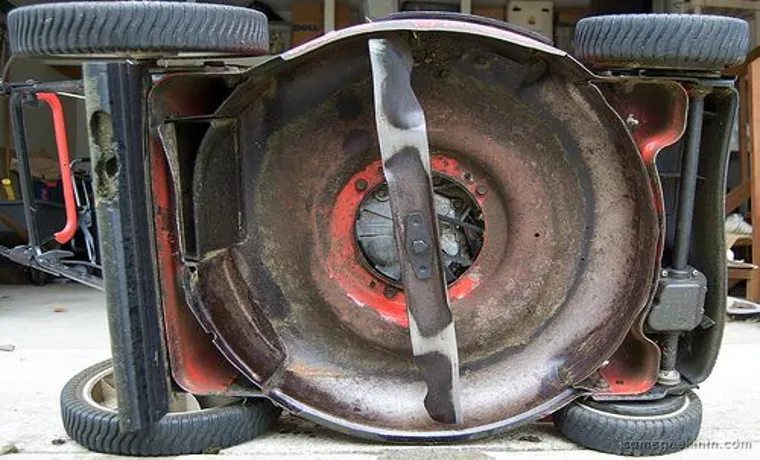 how to lower the blade on a lawn mower