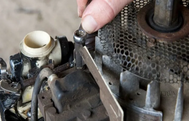 how to take off carburetor on lawn mower