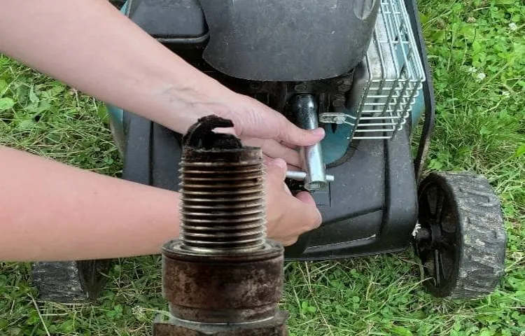 how to take spark plug out of lawn mower