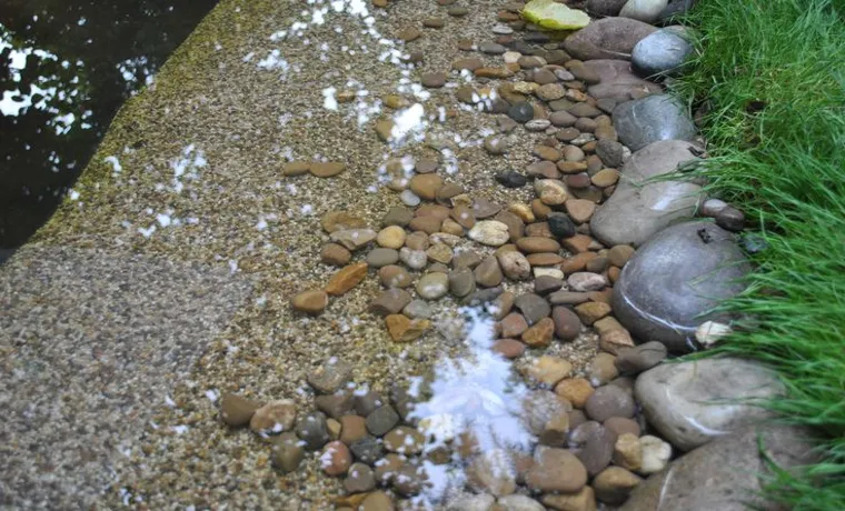 how to cover pond liner with rocks